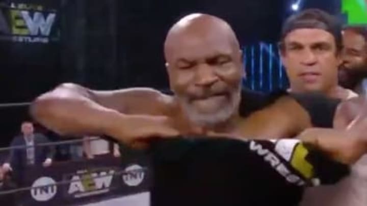 Boxing legend Mike Tyson struggled to rip his shirt off on AEW Dynamite.