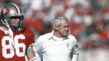 Former San Francisco 49ers coach Bill Walsh on the sidelines during a game.